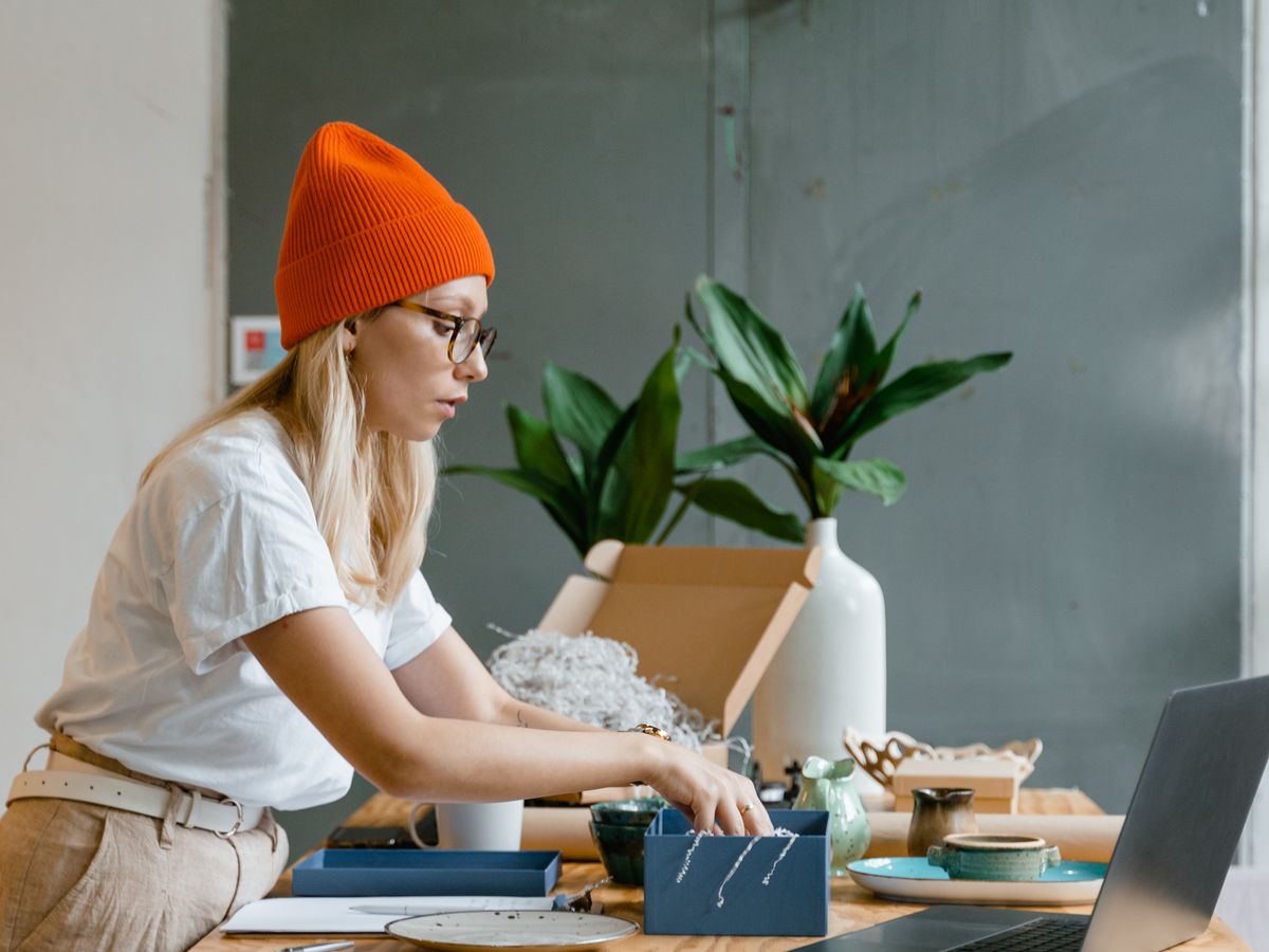 A seller packing an order at their desk